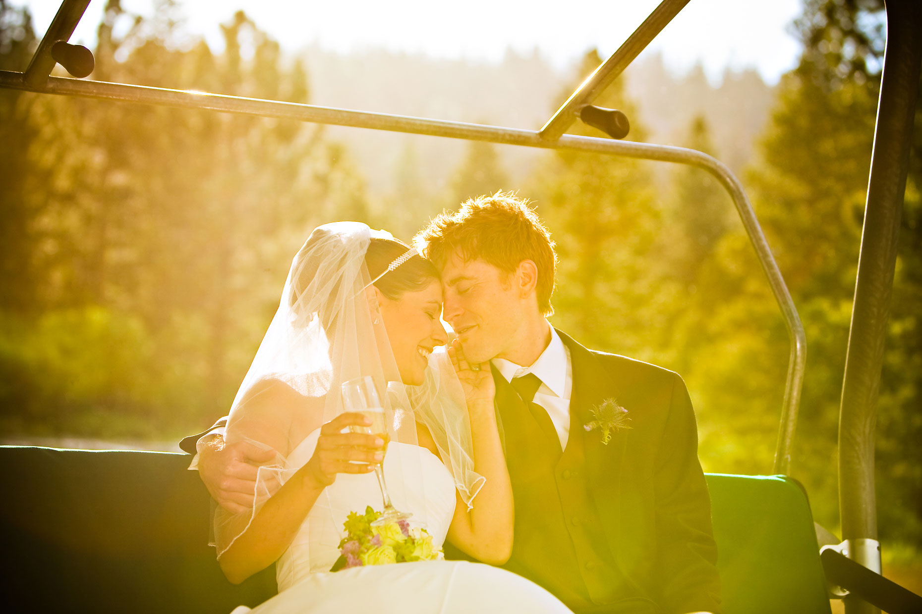 Mammoth mountain wedding photographer on ski lift.