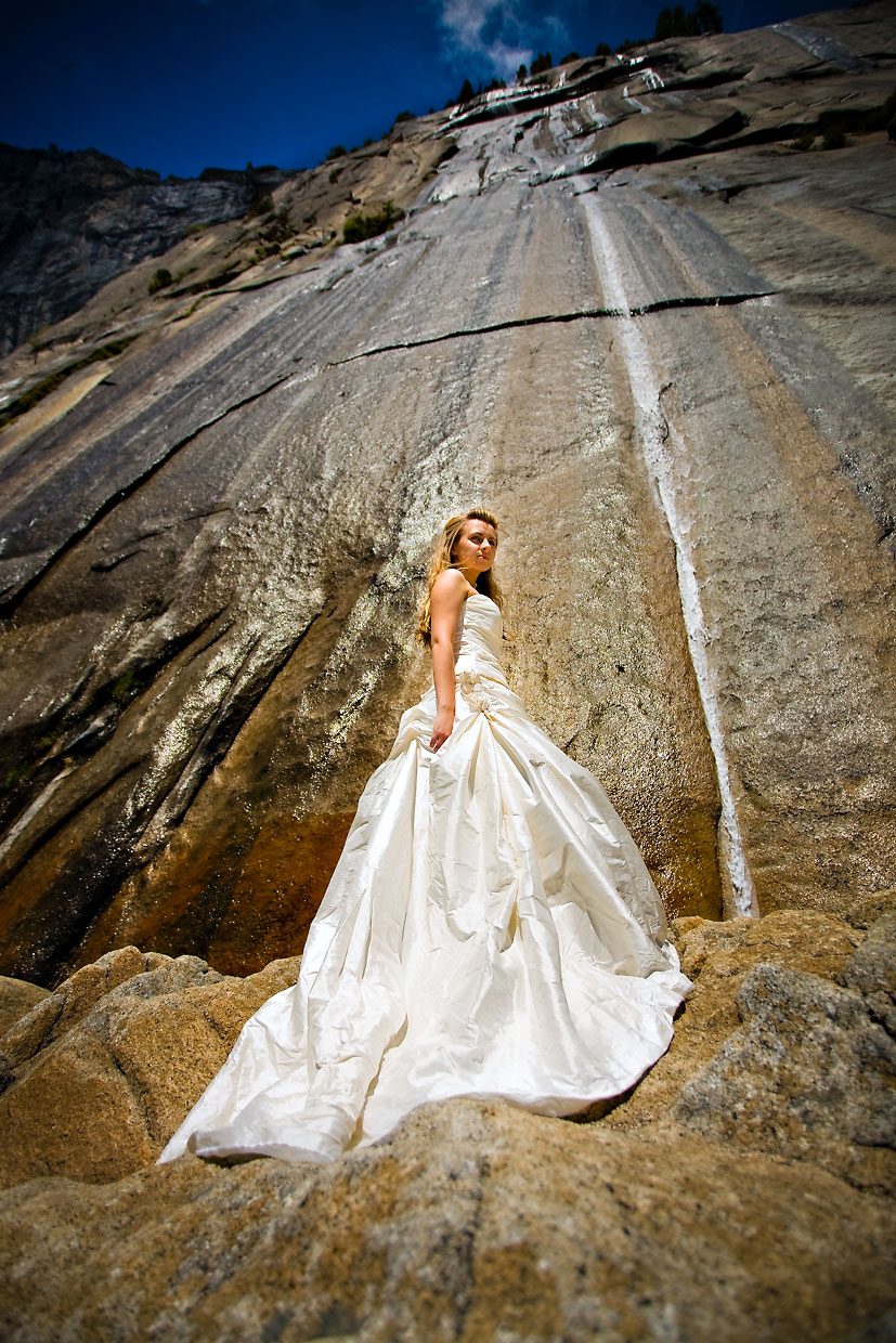 Bride on cliff edge above Ahwahnee in Yosemite.