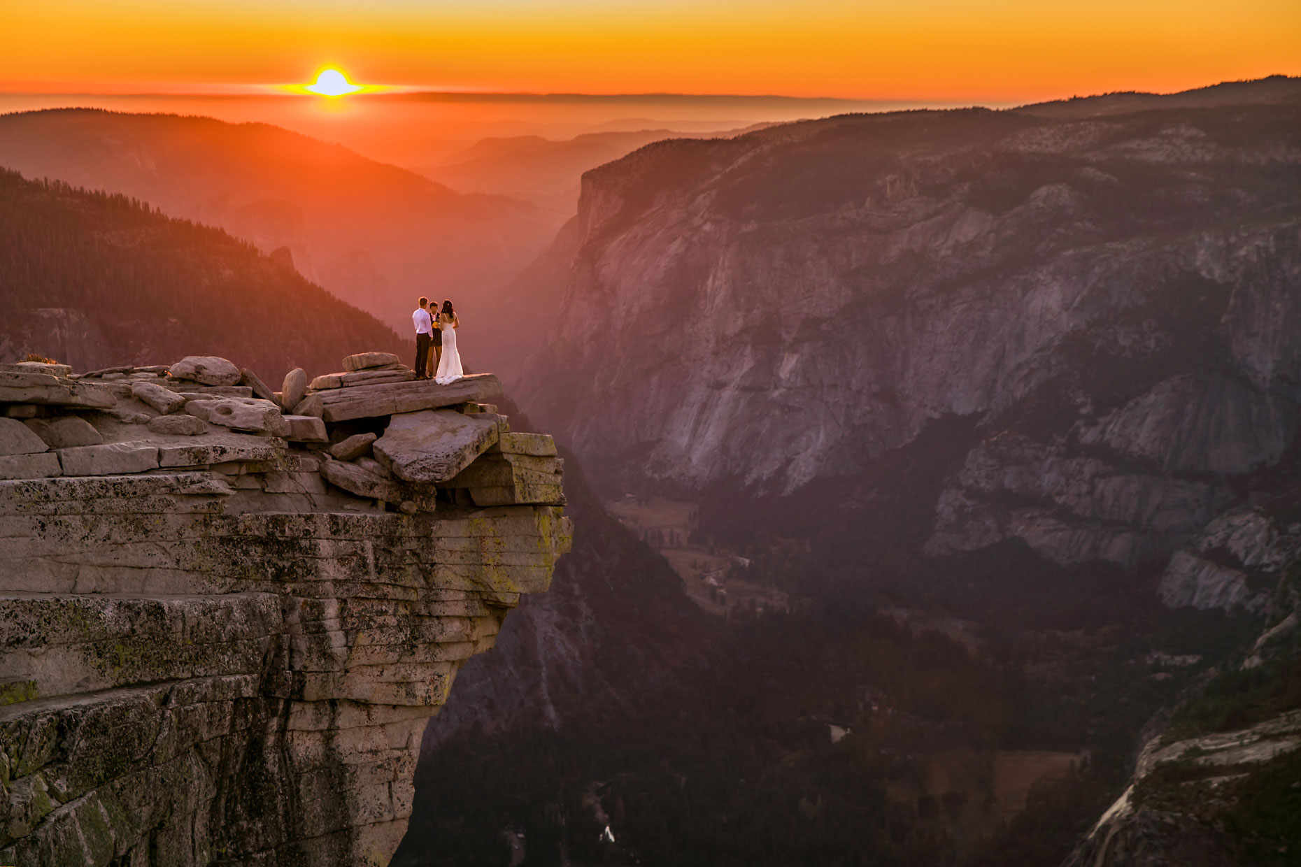 Yosemite adventure elopement photographer on Half Dome at sunset.