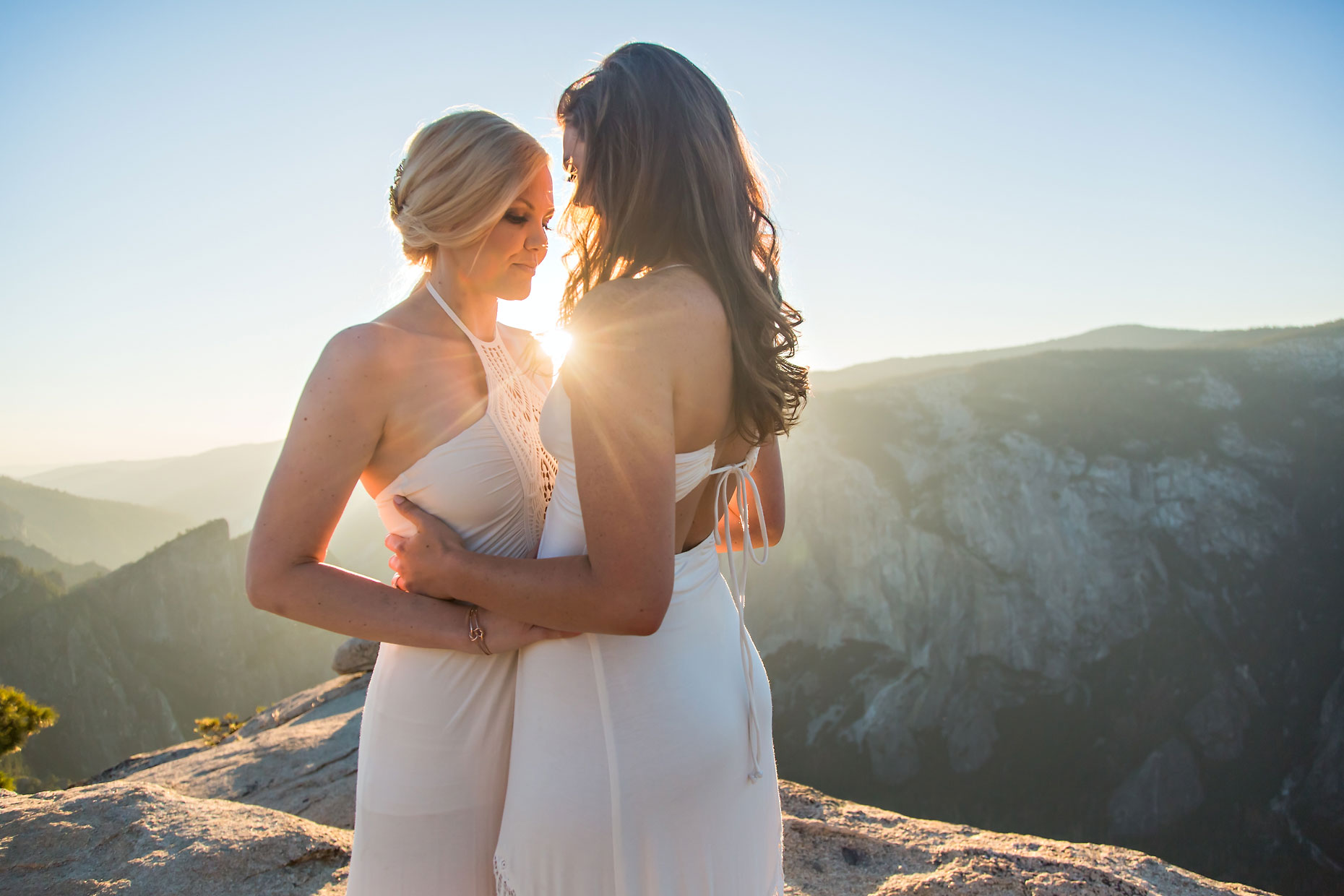 Lesbian wedding photographer at Taft Point in Yosemite.