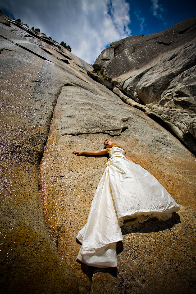 Bride on cliff in Yosemite above the Ahwahnee.