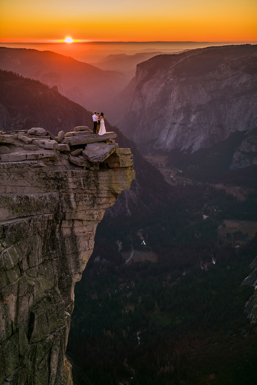 Adventure elopement photographer on the summit of Half Dome in Yosemite.