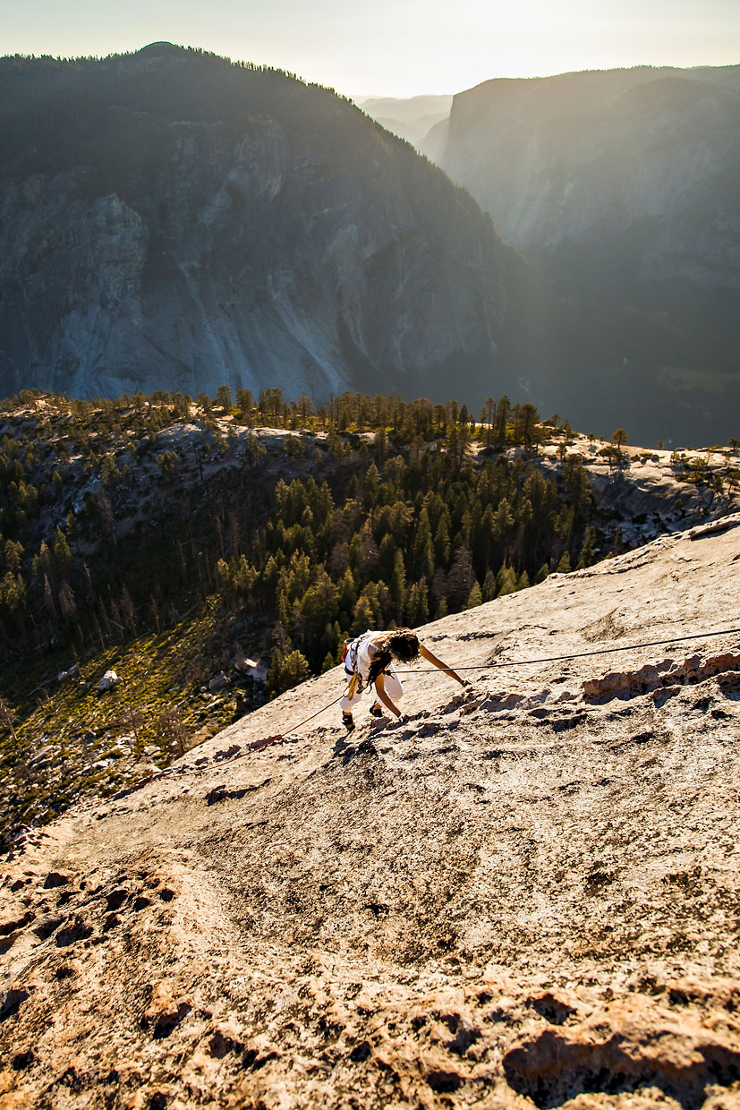 Bride climbing Snake Dike on Half Dome in Yosemite.