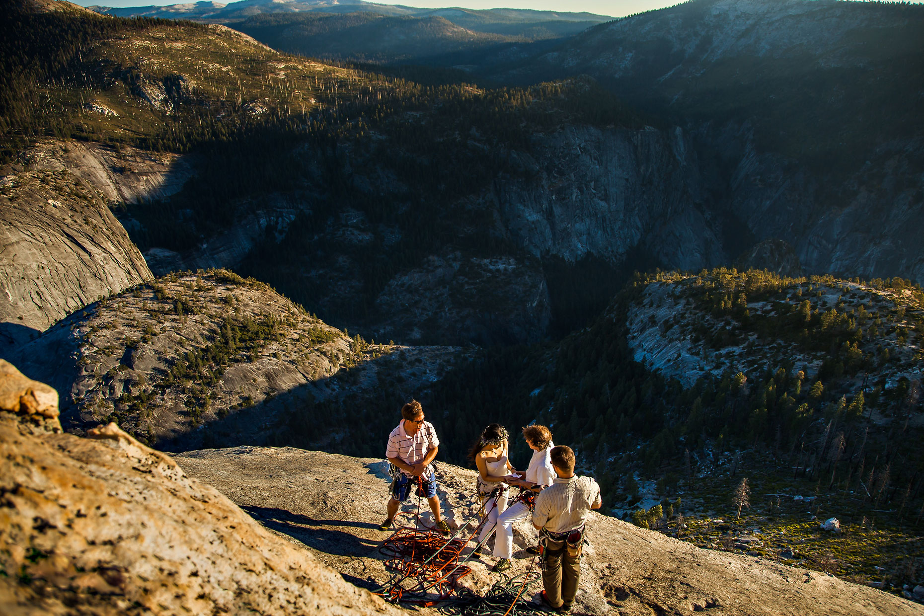 Adventure elopement climbing photographer on Half Dome in Yosemite.
