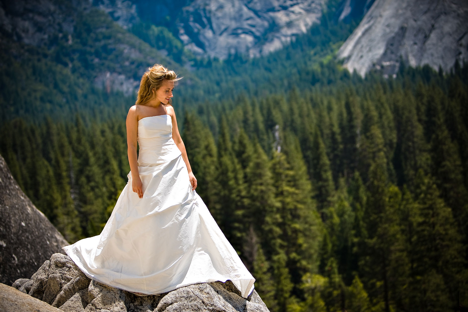 Bride on edge of cliff in Yosemite.